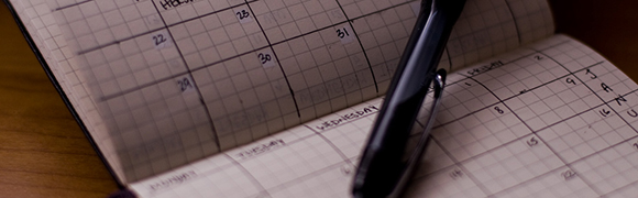 Calendar and a black pen